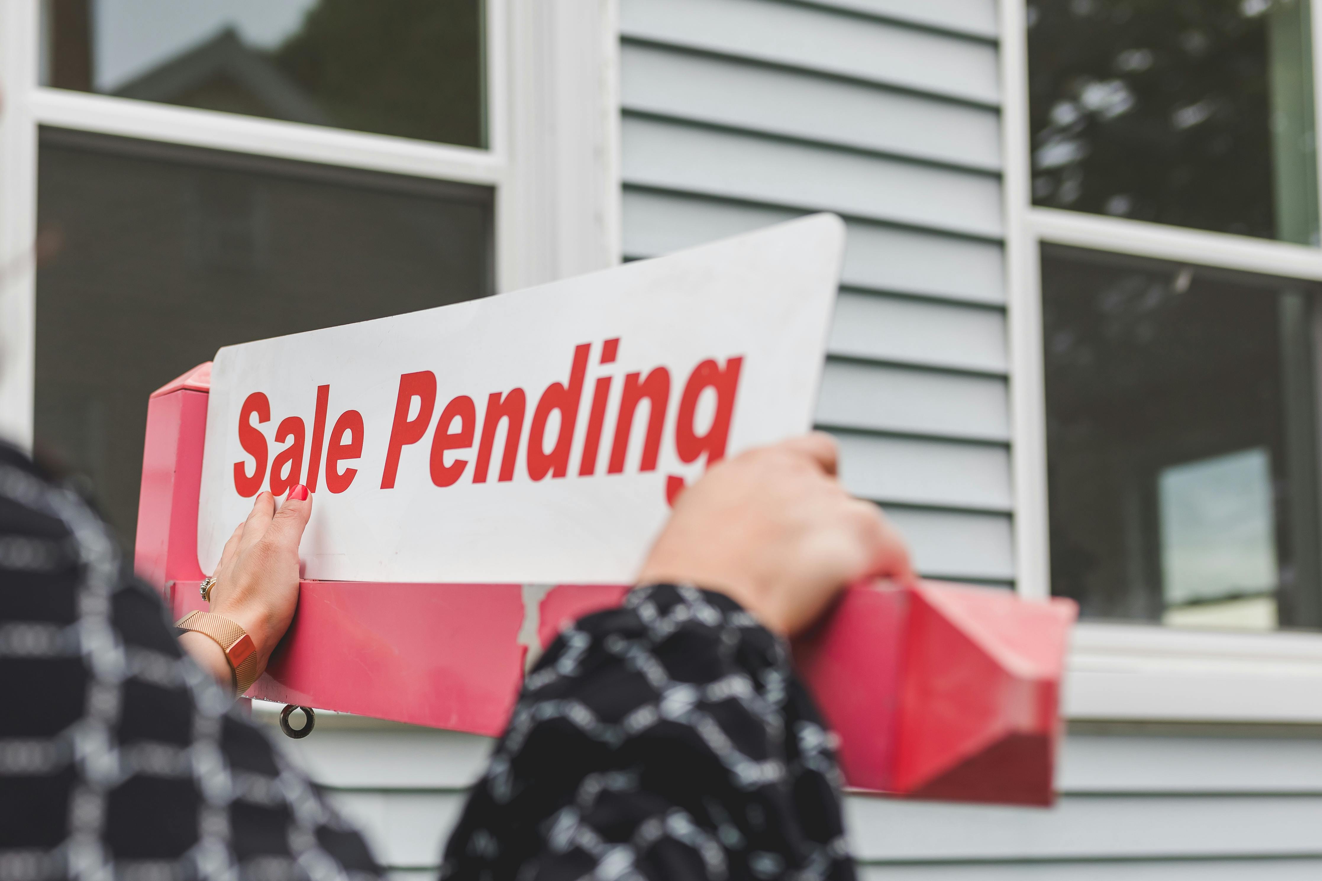 Pending home sale sign in Austin neighborhood